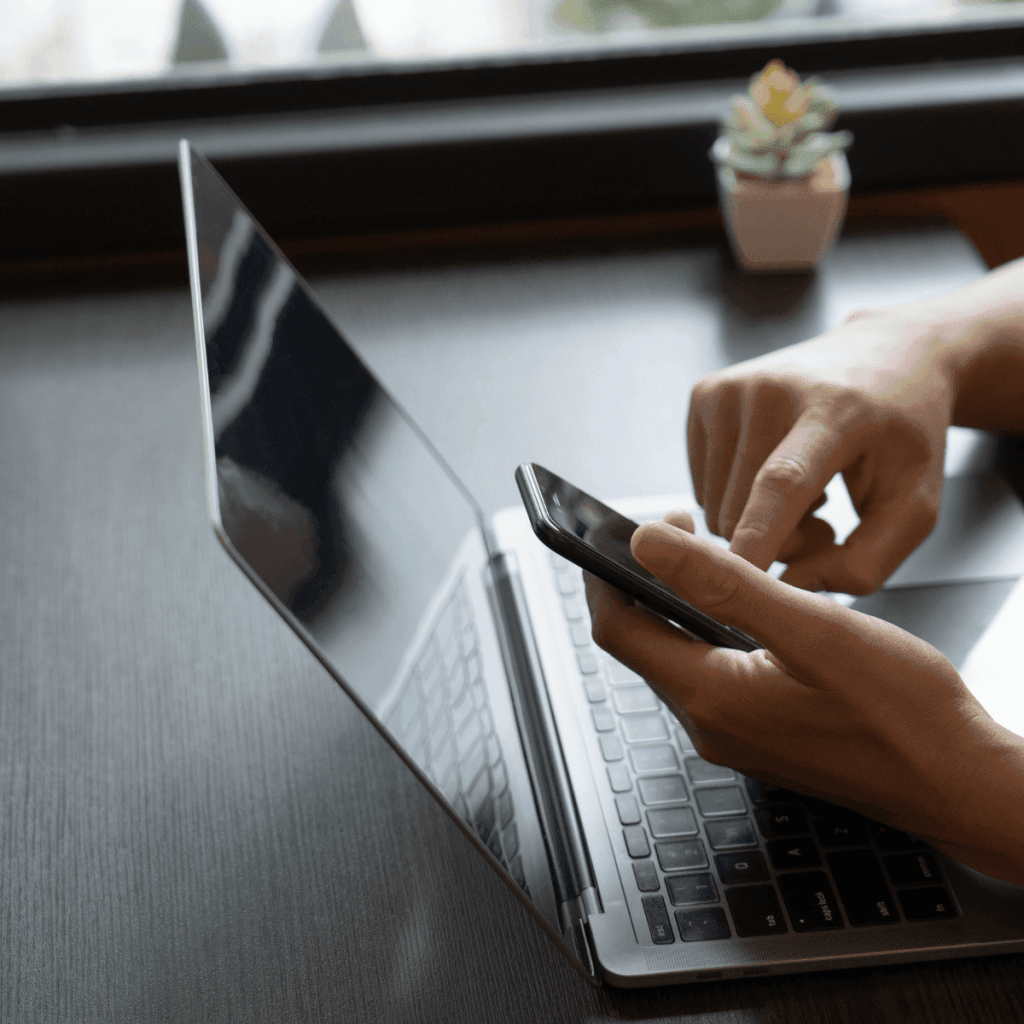 freelance digital marketer in malappuram, a man using the laptop, with phone